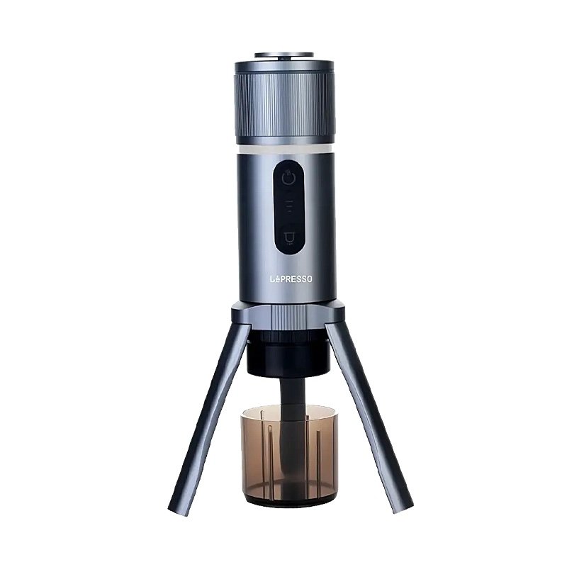 LePresso BrewJet portable espresso machine, grey, standing on its three legs over a cup